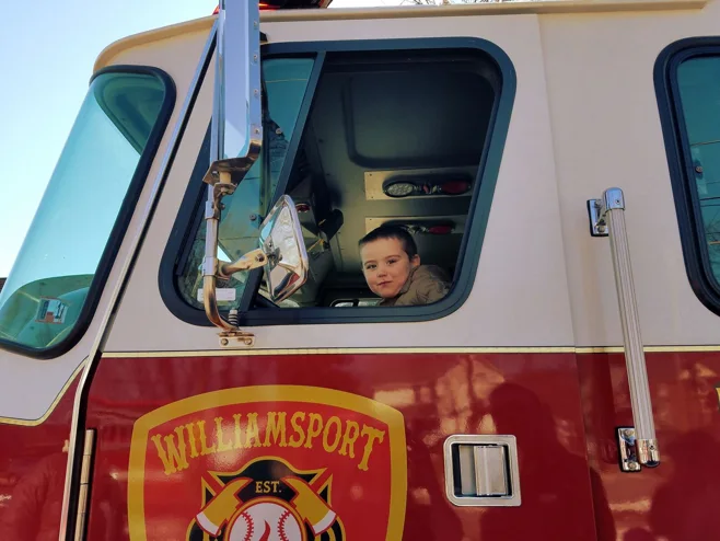 child in firetruck child in firetruck